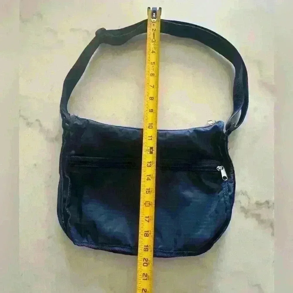 American Tourister dark blue nylon adjustable strap crossbody bag.